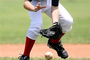 Baseball player catching a ground ball